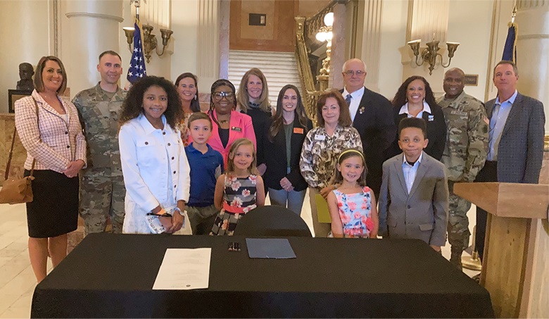 The author and stakeholders of HB21-1217 at the bill signing.  Source: US Air Force.
