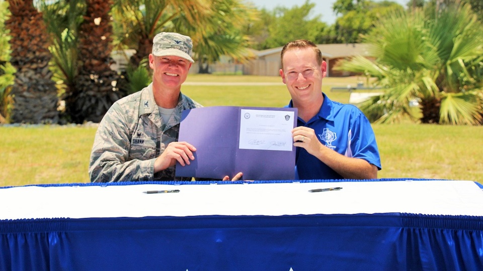 47th Flight Training Wing Commander Colonel Thomas Shank and San Felipe Del Rio CISD Board of Trustees President Joshua D. Overfelt sign the lease agreement for the creation of a new STEM elementary magnet school on Laughlin AFB