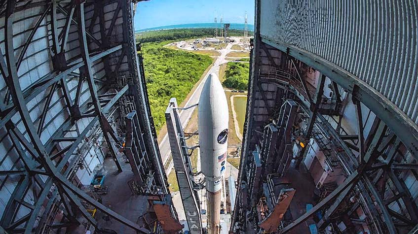 Image of a rocket being rolled out of a hangar