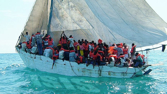 Artist's digital painting of population migration by boat with the reflection of the letters ISIS in the water.