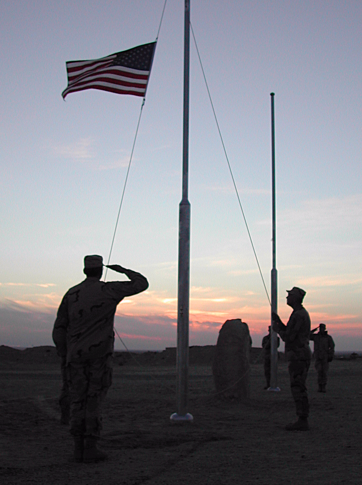 Soldier saluting US flag