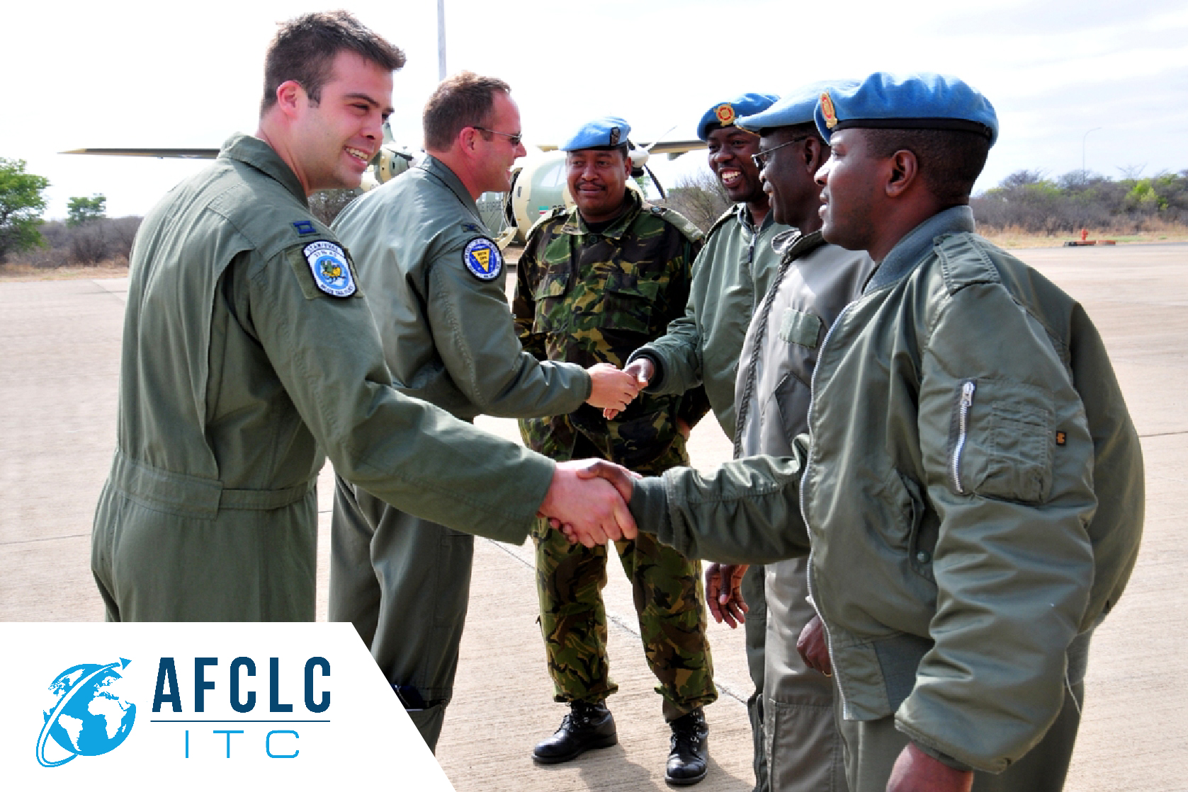U.S. Airman shakes hands with an Airman from another country U.S. Airman shakes hands with an Airman from another country
