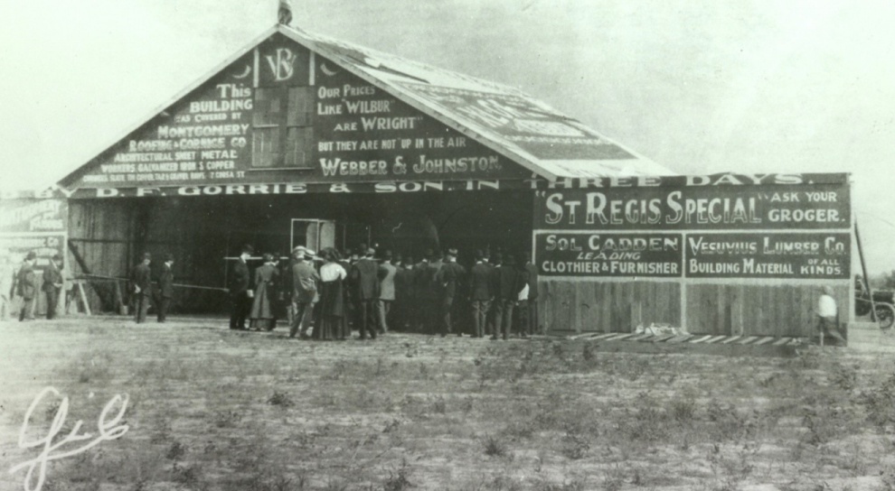 A vintage photo of a barnDescription automatically generated